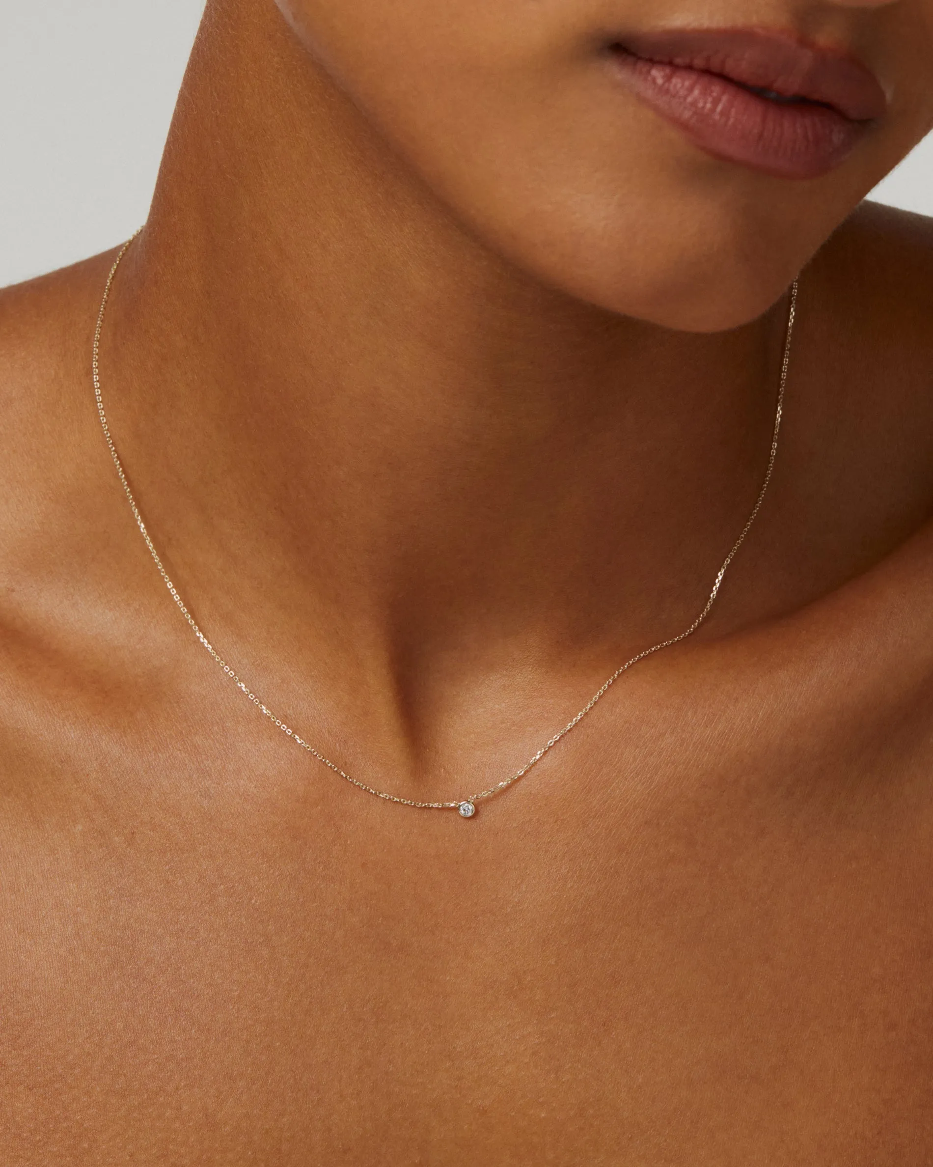 0.035 TCW Round Moissanite Diamond Bezel Necklace