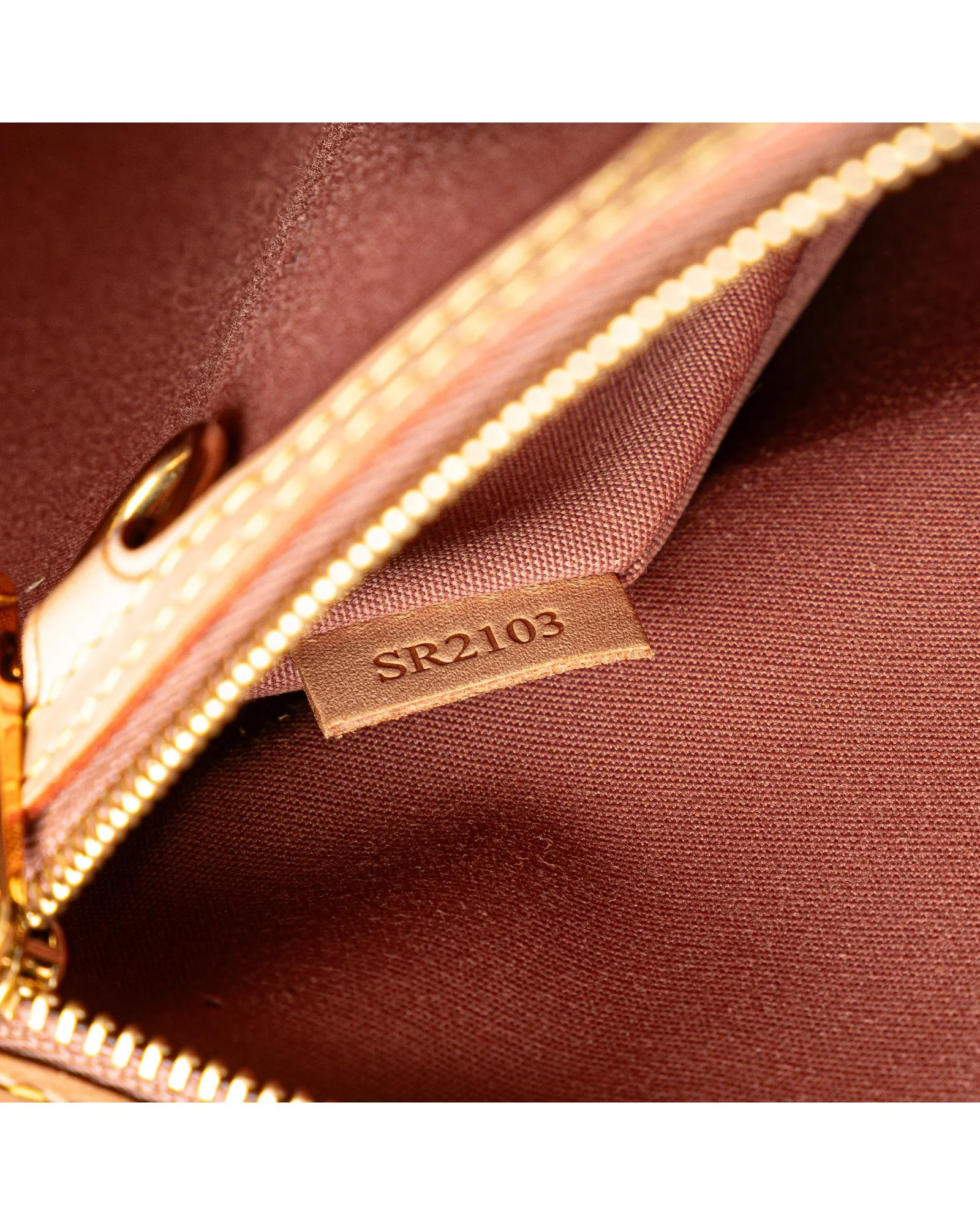 Monogram Vernis Leather Handbag with Vachetta Trim and Detachable Strap